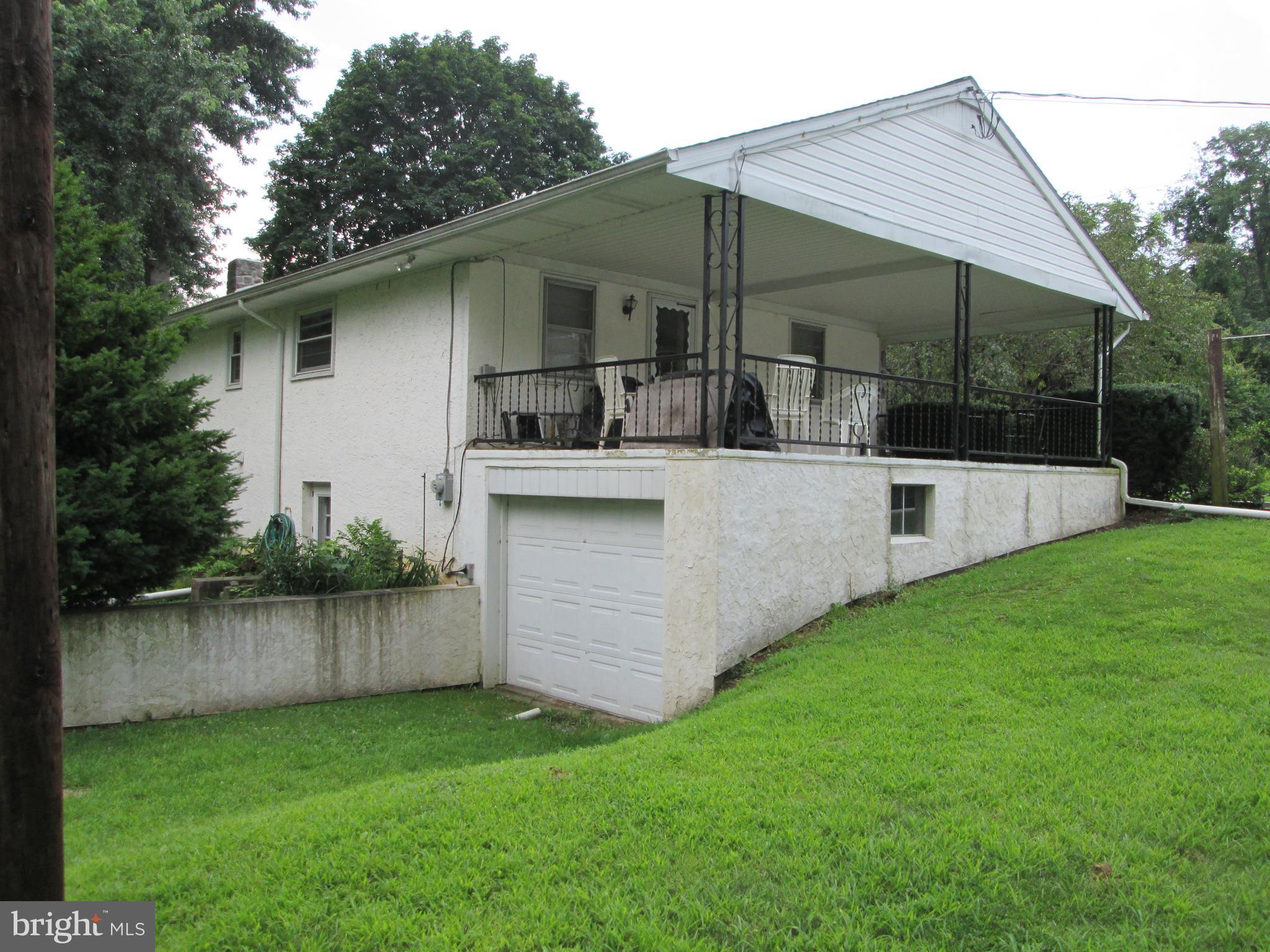 71 Woodchoppertown Road Boyertown, PA 19512 - Photo 8 of 31 a view of backyard with barbeque grill and wooden fence