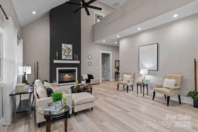 a living room with furniture and a fireplace