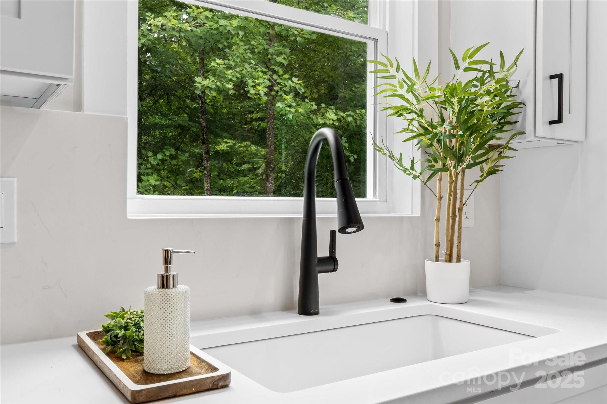 4435 Cornett Drive Iron Station, NC 28080 - Photo 12 of 46 a vase of flowers sitting on a table with window