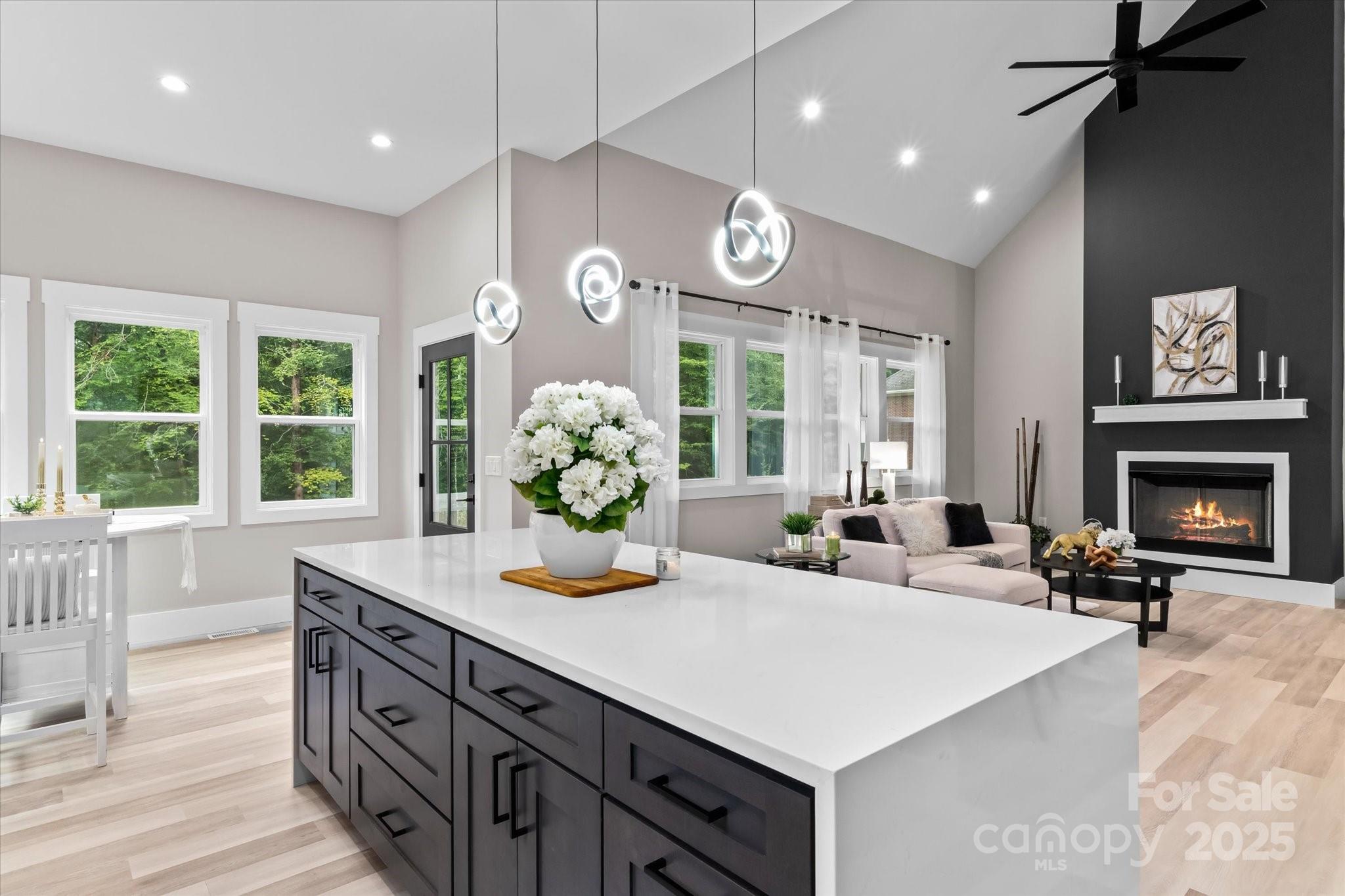 4435 Cornett Drive Iron Station, NC 28080 - Photo 13 of 46 a living room with furniture a fireplace and a large window