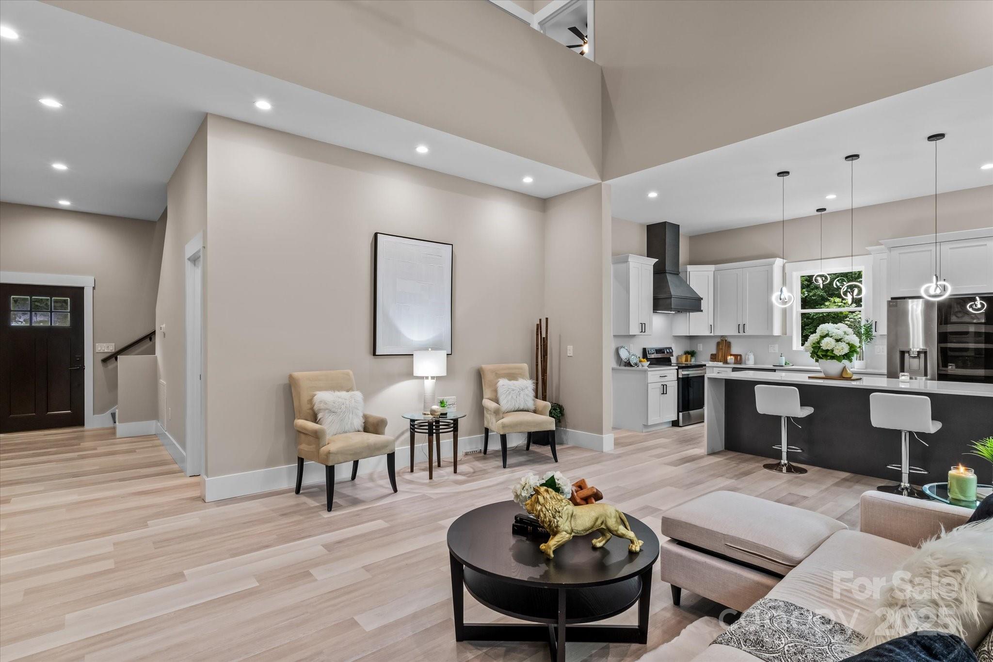4435 Cornett Drive Iron Station, NC 28080 - Photo 16 of 46 a living room with furniture kitchen and a table