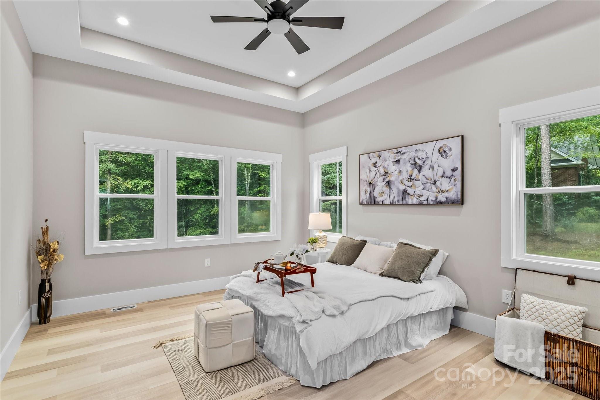 4435 Cornett Drive Iron Station, NC 28080 - Photo 21 of 46 a spacious bedroom with a bed and a large window
