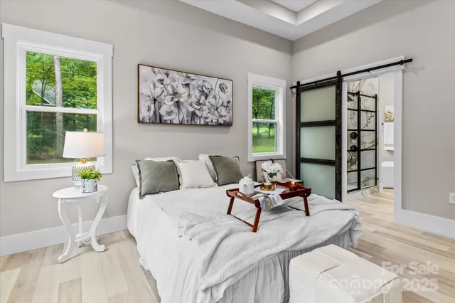 a living room with furniture and next to a window