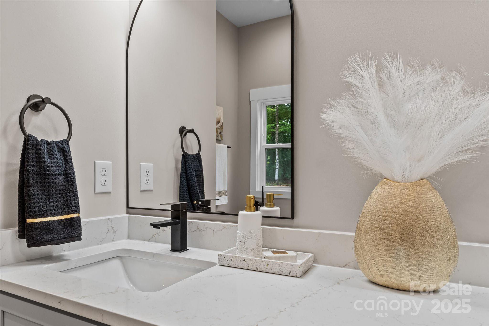 4435 Cornett Drive Iron Station, NC 28080 - Photo 29 of 46 a bathroom with a sink and a mirror
