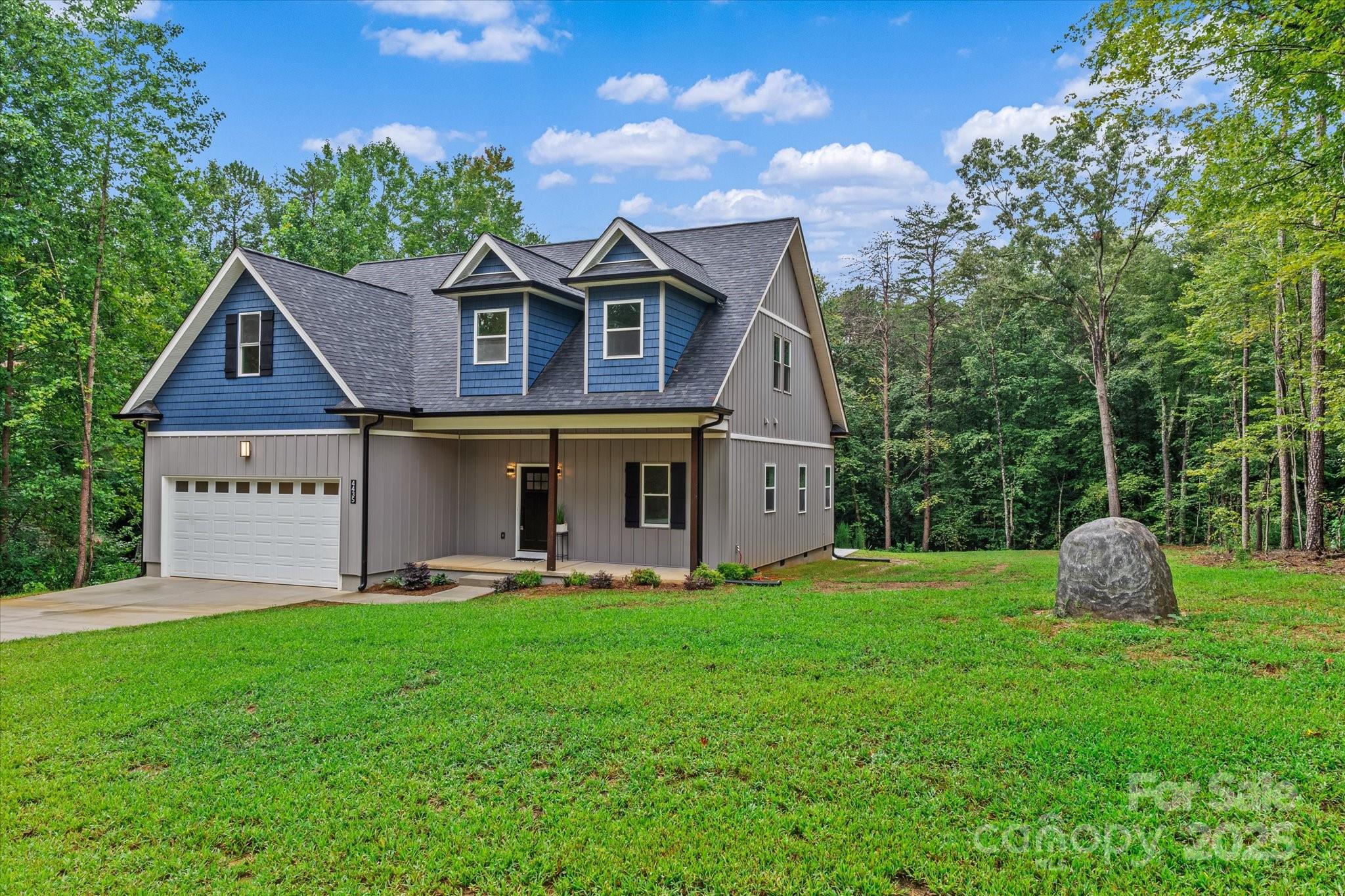 4435 Cornett Drive Iron Station, NC 28080 - Photo 4 of 46 a front view of a house with garden