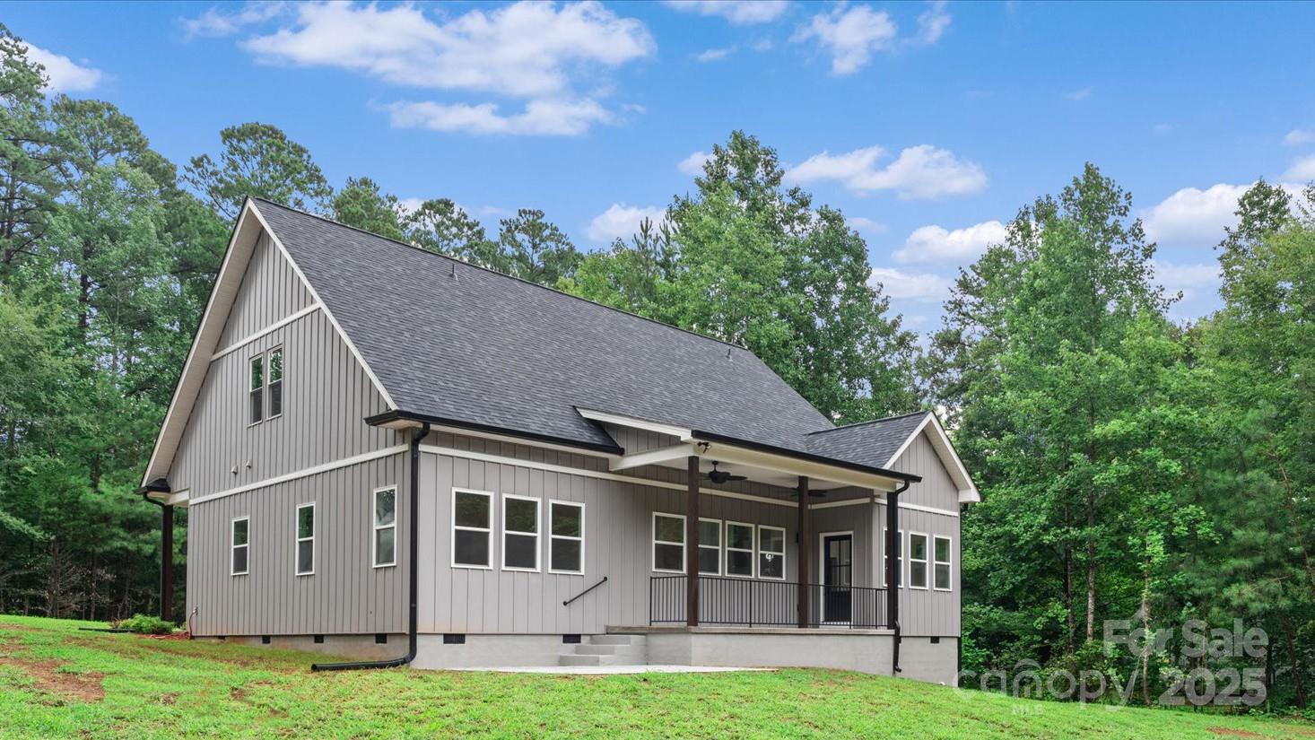 4435 Cornett Drive Iron Station, NC 28080 - Photo 45 of 46 a aerial view of a house next to a big yard and large trees