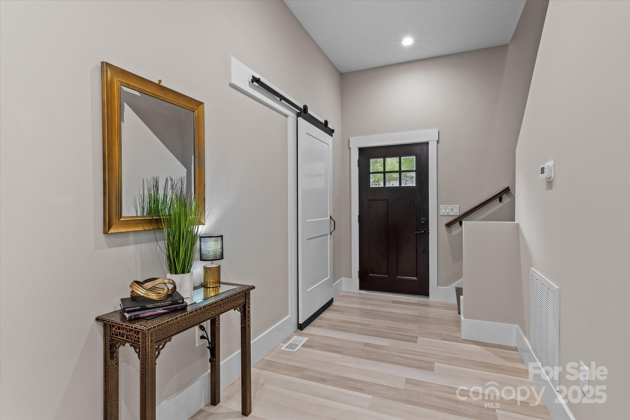 4435 Cornett Drive Iron Station, NC 28080 - Photo 5 of 46 a view of a hallway with wooden floor and windows