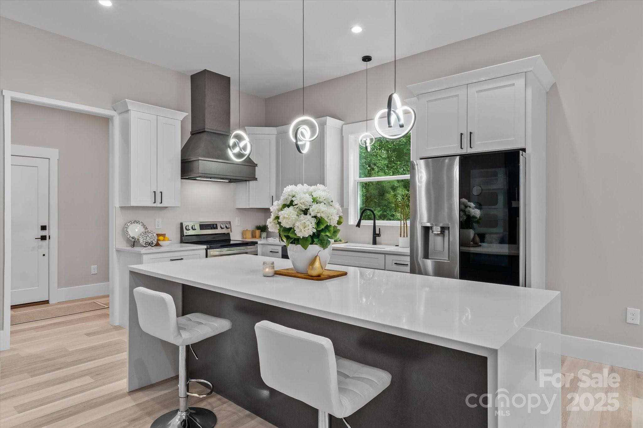 4435 Cornett Drive Iron Station, NC 28080 - Photo 8 of 46 a kitchen with a table and chairs in it