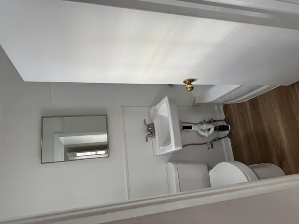 a bathroom with a sink and mirror