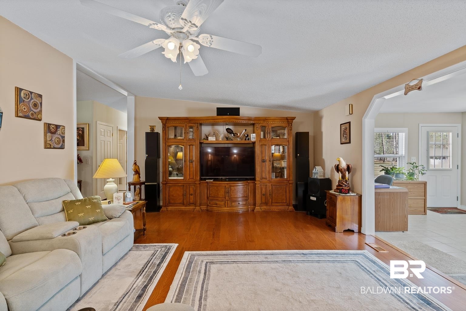 10647 Rte Road Lillian, AL 36549 - Photo 23 of 62 Living area featuring light wood-type flooring, ceiling fan, and vaulted ceiling