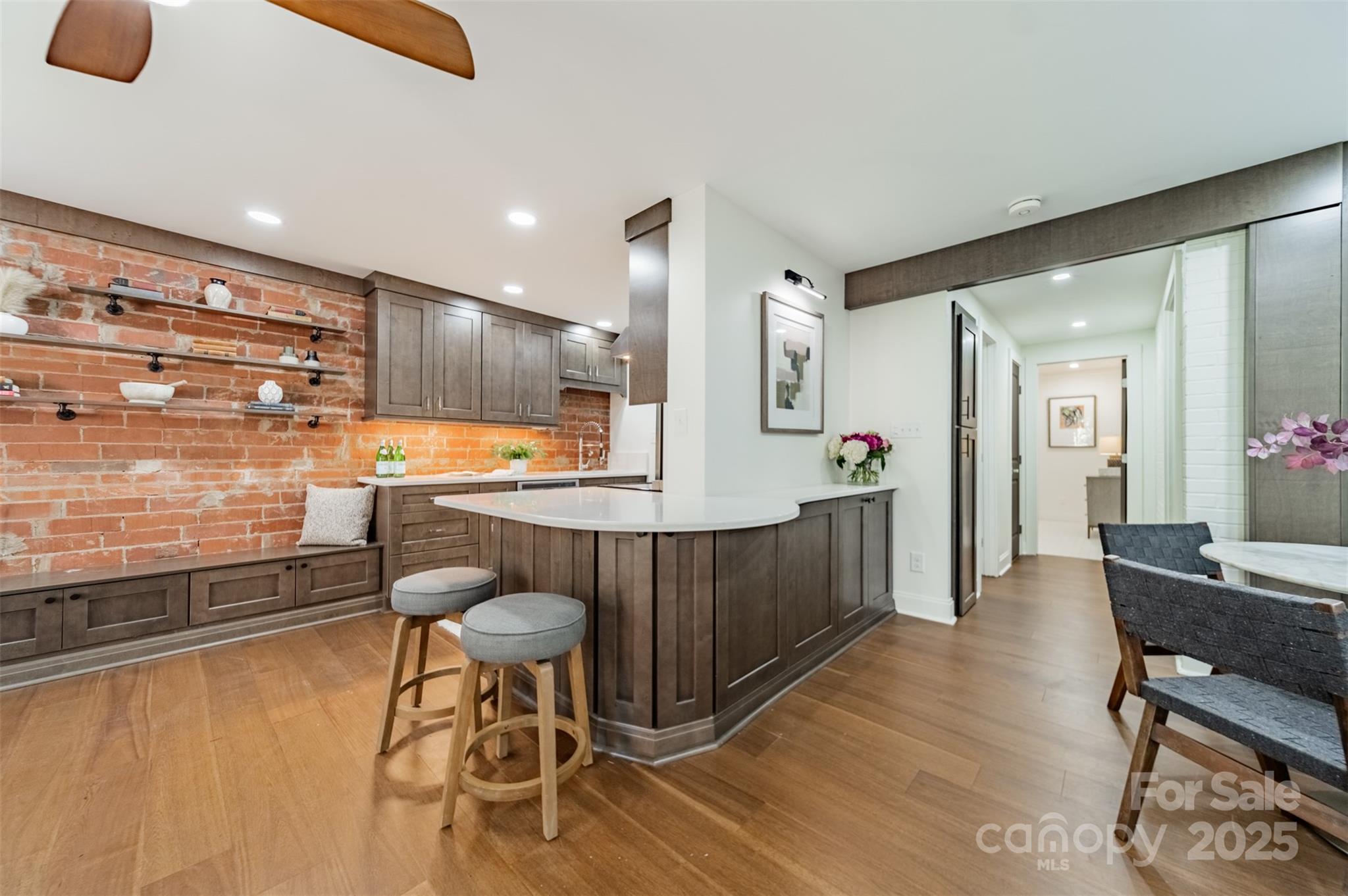 400 Queens Road, Unit D6 Charlotte, NC 28207 - Photo 13 of 26 a large kitchen with a table and chairs