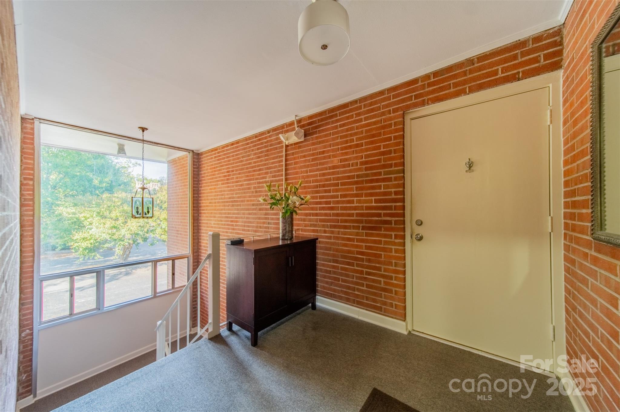 400 Queens Road, Unit D6 Charlotte, NC 28207 - Photo 22 of 26 a view of an empty room with a window