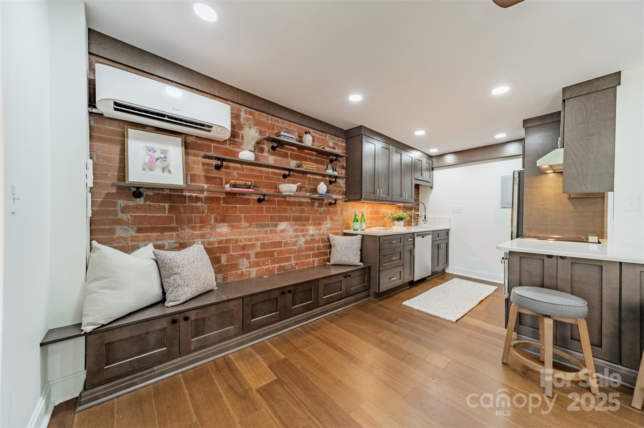 400 Queens Road, Unit D6 Charlotte, NC 28207 - Photo 6 of 26 a kitchen with stainless steel appliances granite countertop a refrigerator and a stove top oven