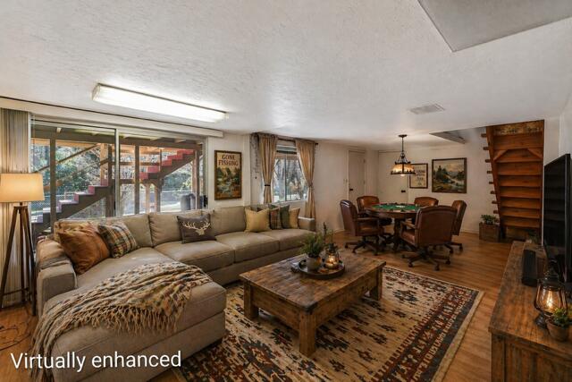 155 Steelhead Circle Lewiston, CA 96052 - Photo 27 of 53 a living room with furniture ceiling fan and a rug