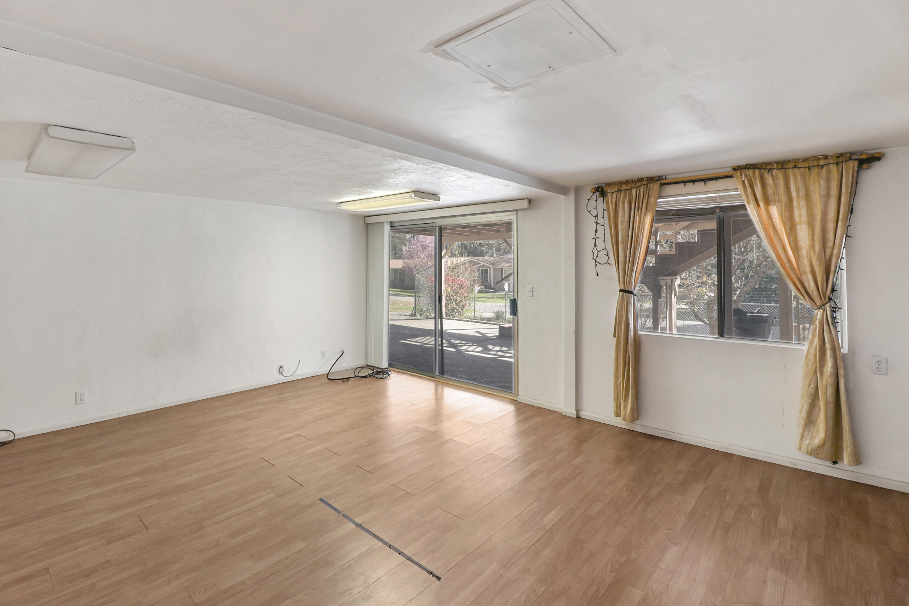 155 Steelhead Circle Lewiston, CA 96052 - Photo 29 of 53 wooden floor in an empty room with a window