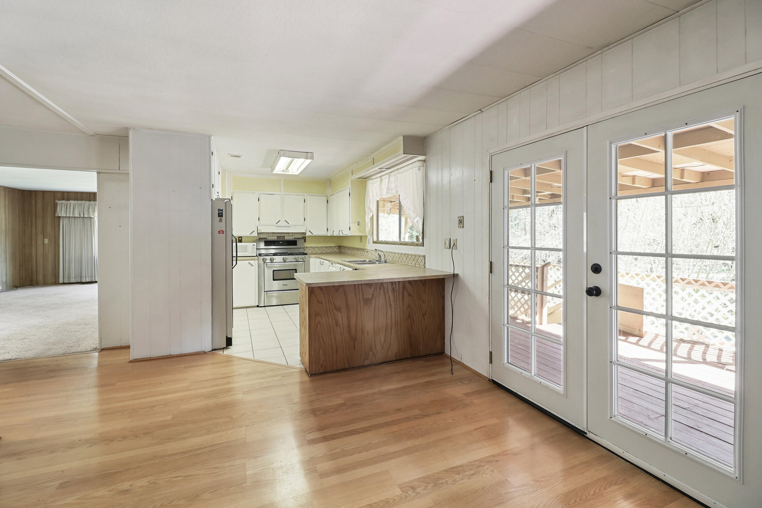 155 Steelhead Circle Lewiston, CA 96052 - Photo 9 of 53 a large kitchen with a window and stainless steel appliances
