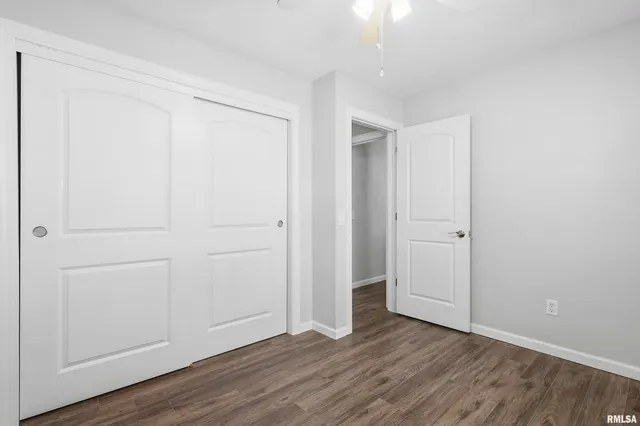 an empty room with wooden floor