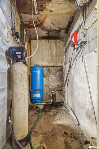 a front view of a house with a yard covered in snow