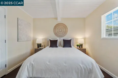 a bedroom with a bed and a closet