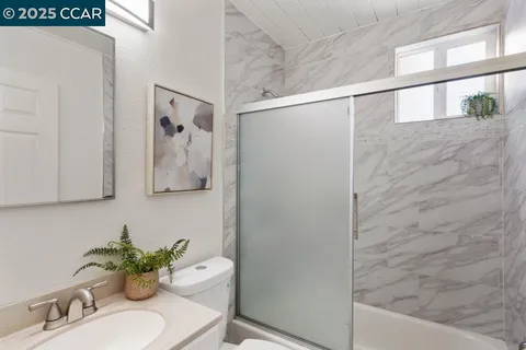 a bathroom with a shower curtain and a sink
