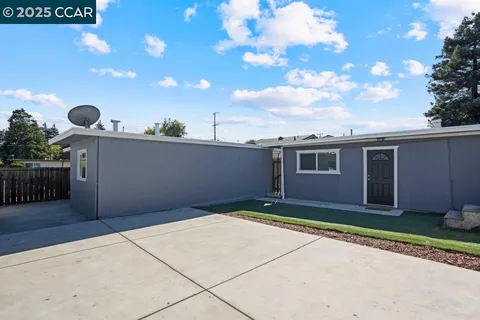 a view of backyard of a house