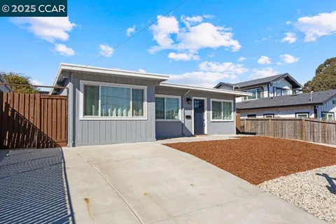 a view of house with yard