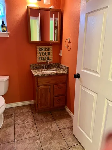 a bathroom with a sink and a toilet