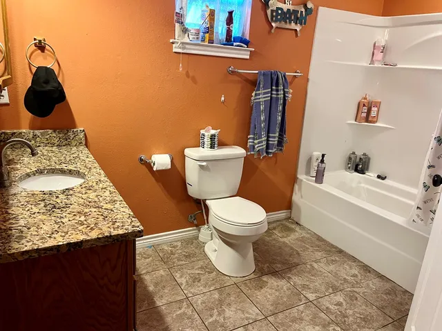 a bathroom with a sink and toilet