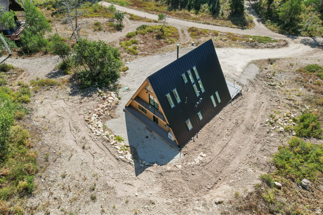 1833 Pine Loop Road Coalville, UT 84017 - Photo 23 of 26 Modern A-frame residence featuring a black corrugated metal roof and siding