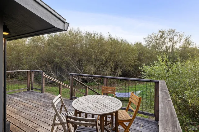 a view of a balcony with furniture