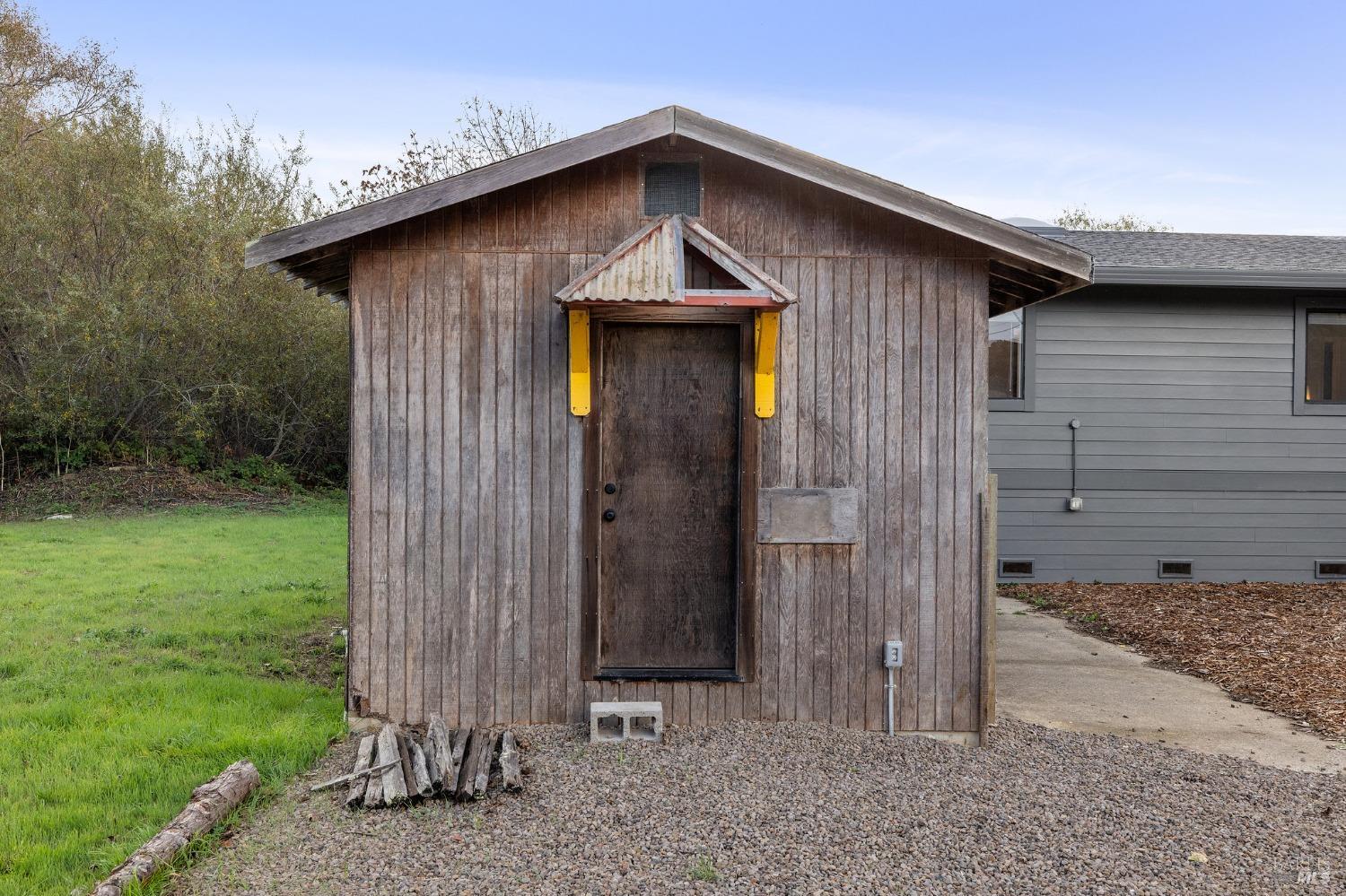 10905 Highway 1 Point Reyes Station, CA 94956 - Photo 24 of 28 a front view of a house with garden