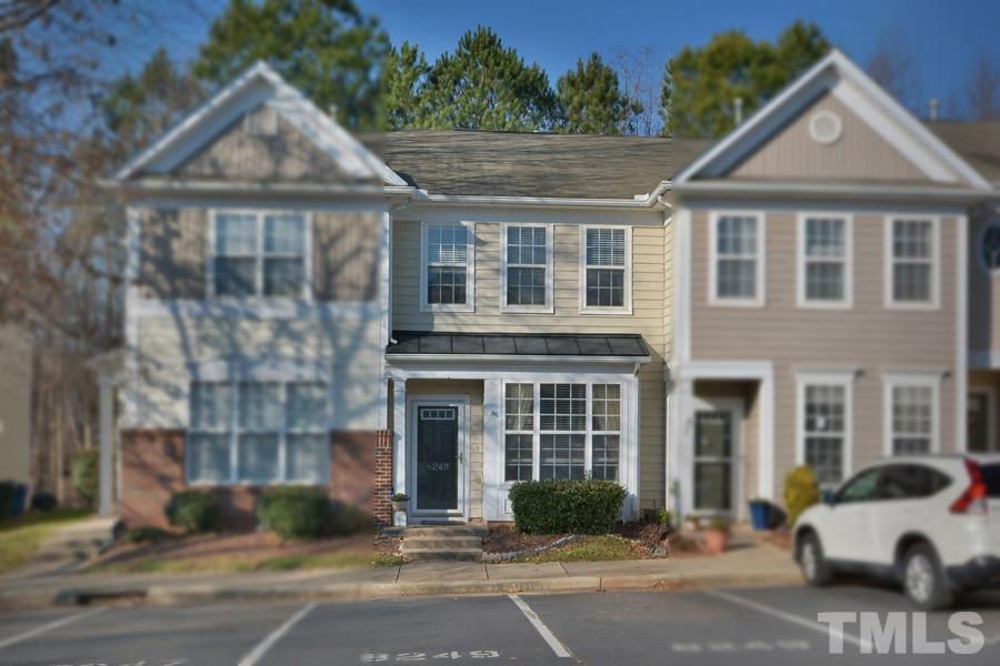8249 City Loft Court Raleigh, NC 27613 - Photo 1 of 28 a front view of a house with a garden