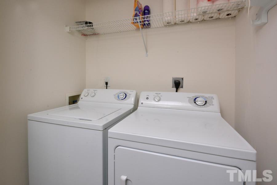 8249 City Loft Court Raleigh, NC 27613 - Photo 23 of 28 a utility room with dryer and washer