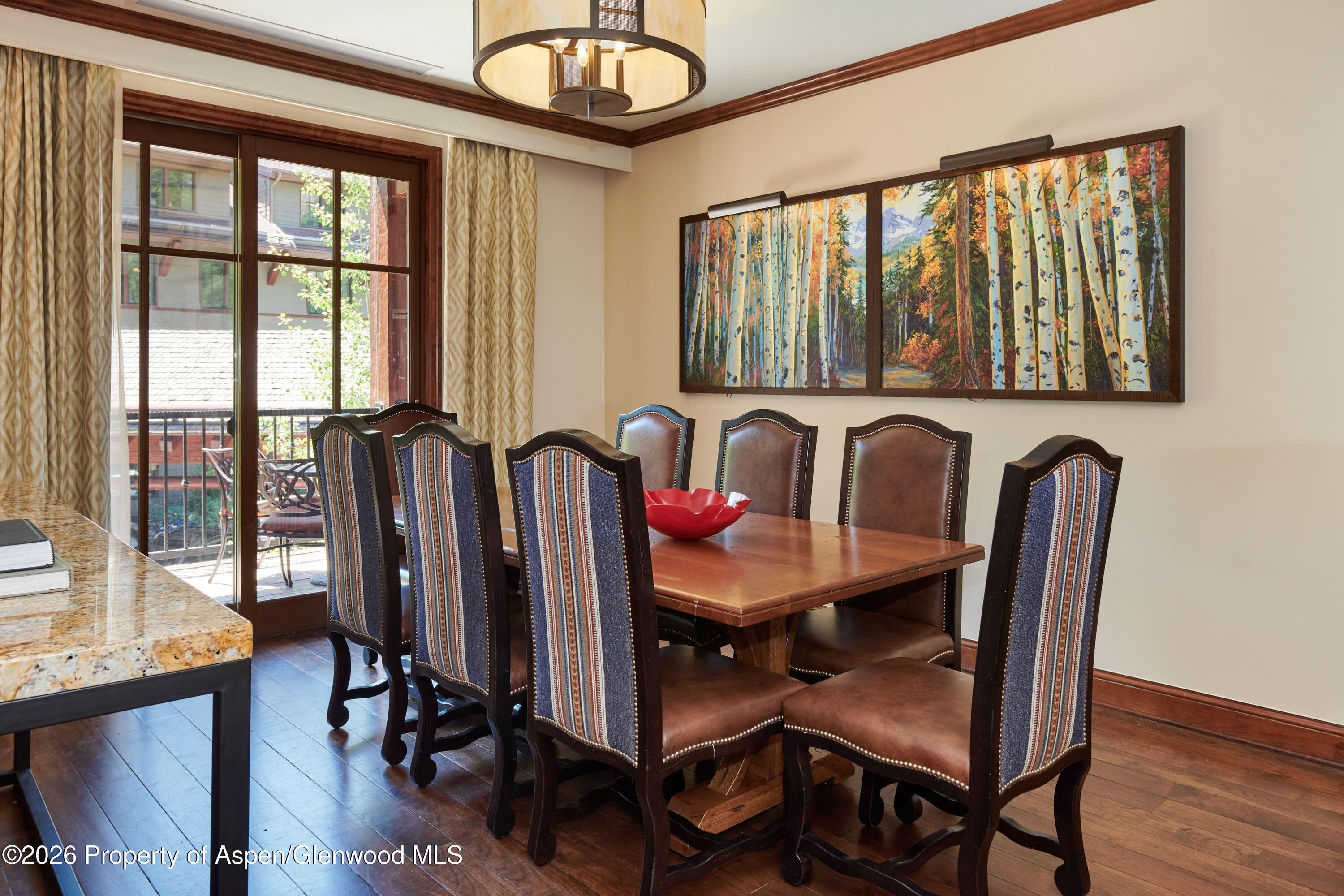 39 Boomerang Road, Unit 83101 Aspen, CO 81611 - Photo 3 of 12 a view of a dining room with furniture window and wooden floor