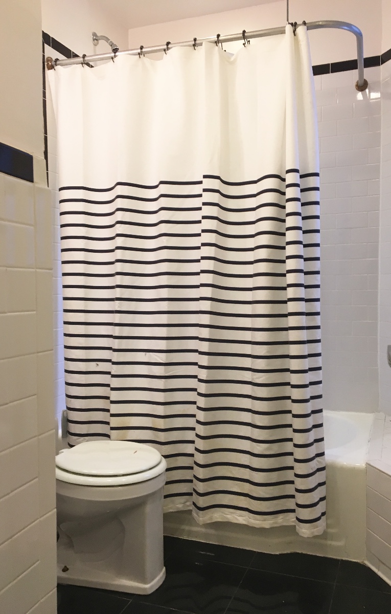 21 East 108th Street, Unit 4A Manhattan, NY 10029 - Photo 6 of 6 a bathroom with a sink and a mirror