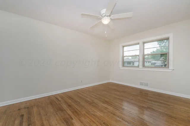 a view of yellow house with a garage