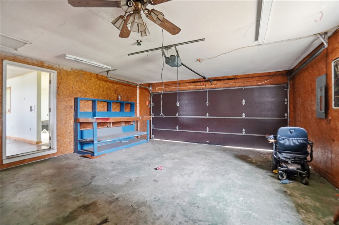 9750 Middlepoint Road Middle Point, OH 45863 - Photo 36 of 43 This spacious garage offers ample storage and direct access, perfect for projects or vehicle parking.