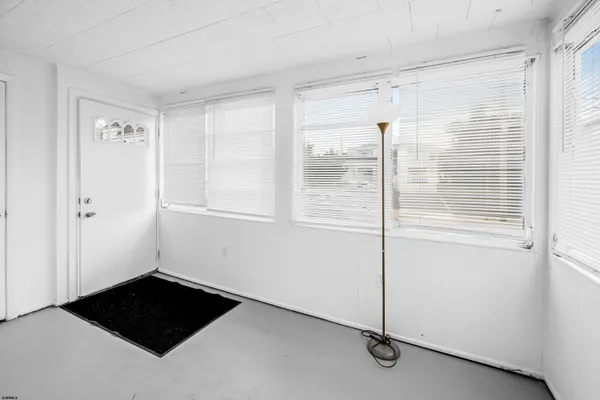 a view of a closet area with an empty room