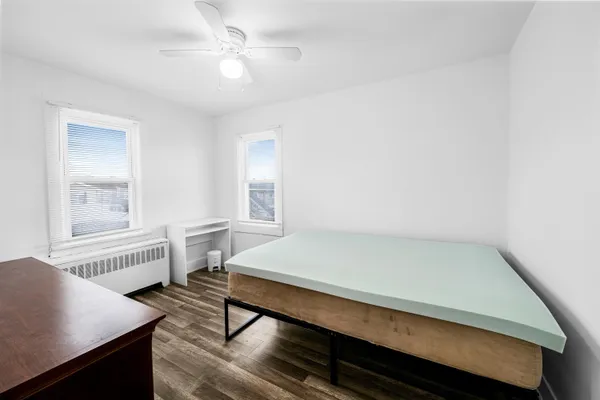 a room with pool table and windows