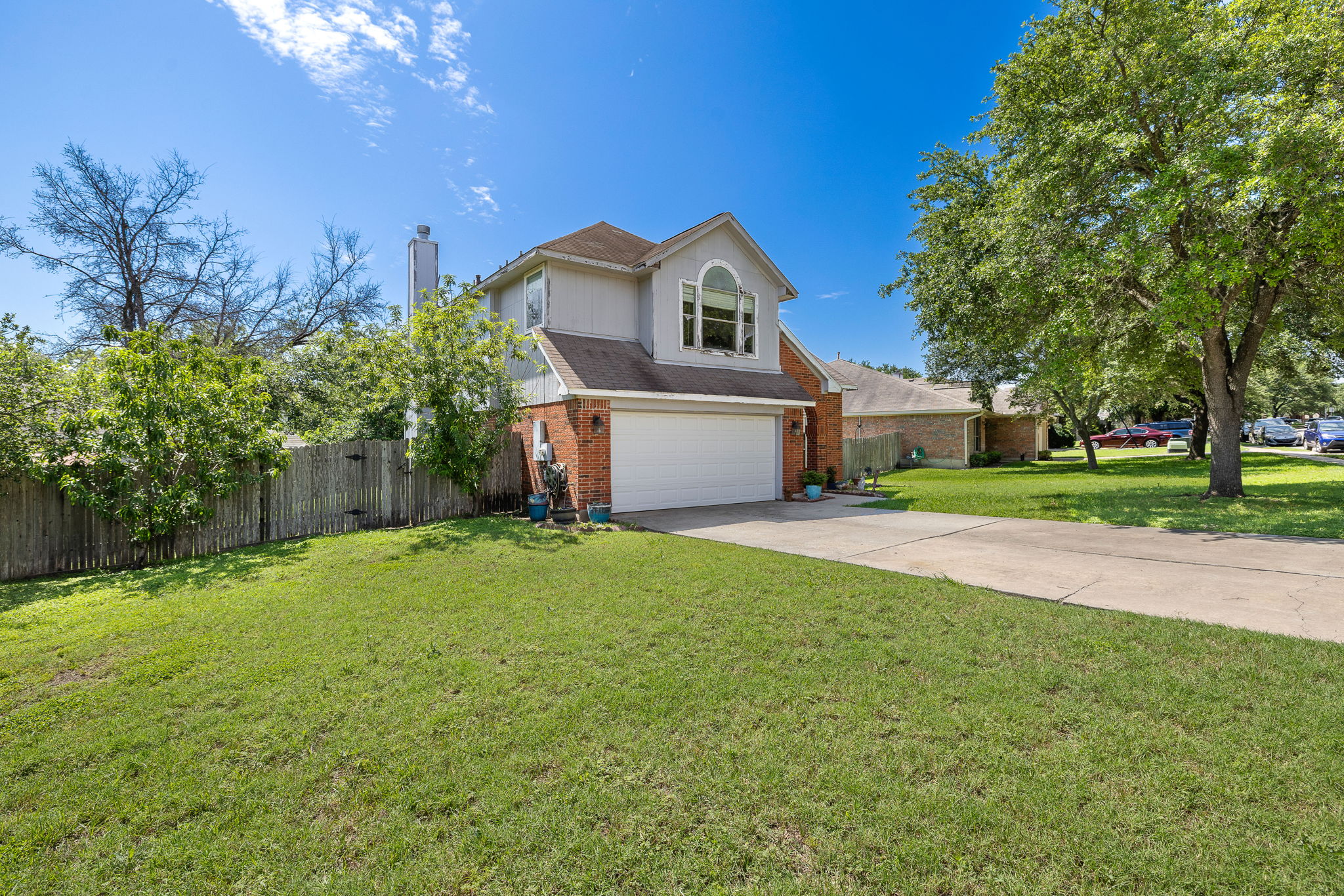 615 Runners Ridge Pflugerville, TX 78660 - Photo 4 of 32 a front view of a house with yard and green space