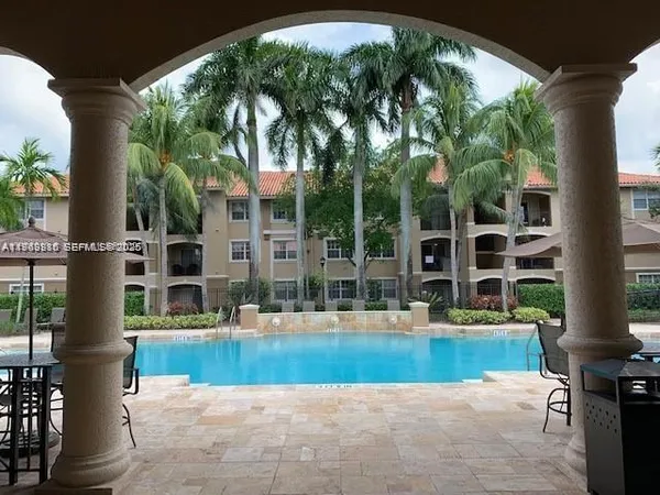 a view of swimming pool with a patio