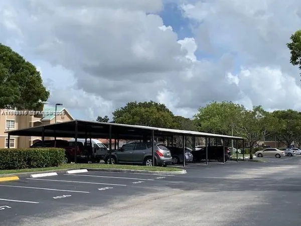 a view of street with parked cars