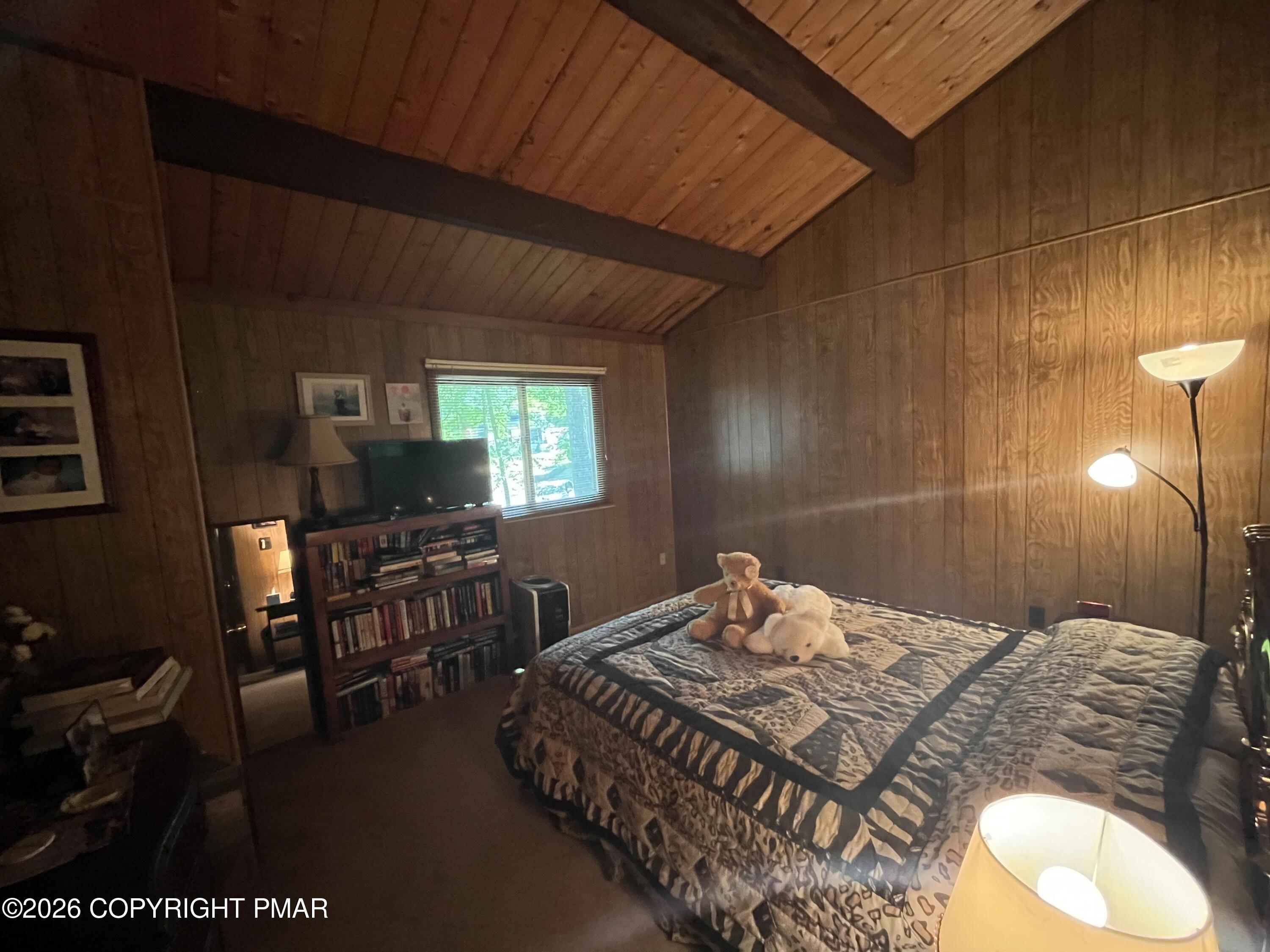 5970 Decker Road Bushkill, PA 18324 - Photo 22 of 26 a bedroom with a bed and a flat screen tv