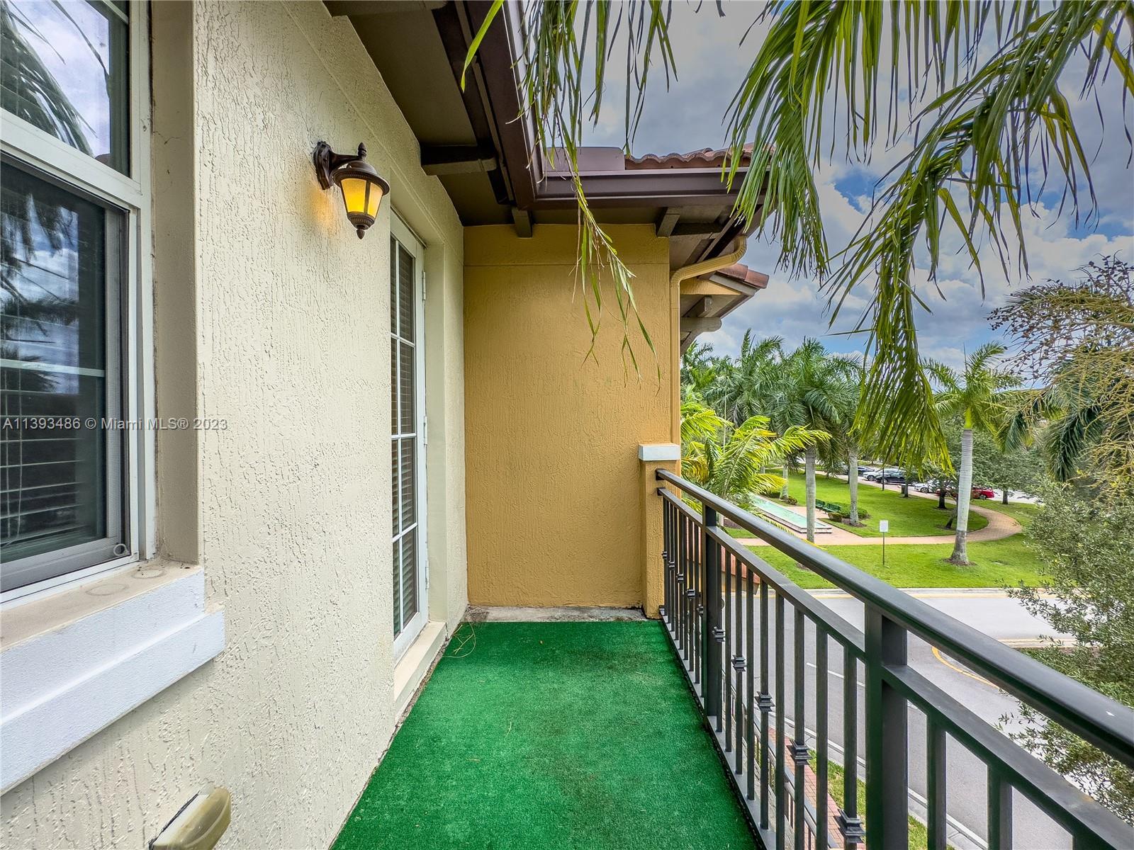 865 Southwest 147th Avenue, Unit 1908 Pembroke Pines, FL 33027 - Photo 17 of 30 a view of a house with a yard