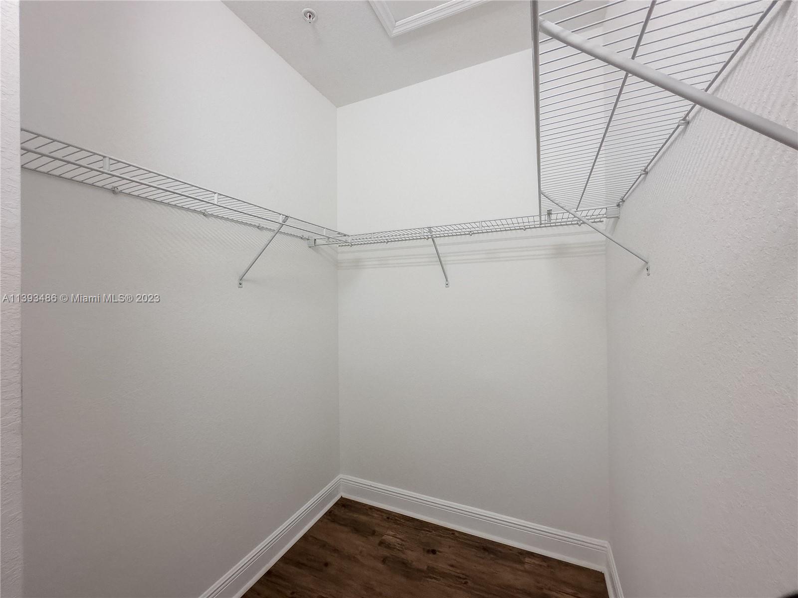 865 Southwest 147th Avenue, Unit 1908 Pembroke Pines, FL 33027 - Photo 18 of 30 a view of a room with racks on the wall