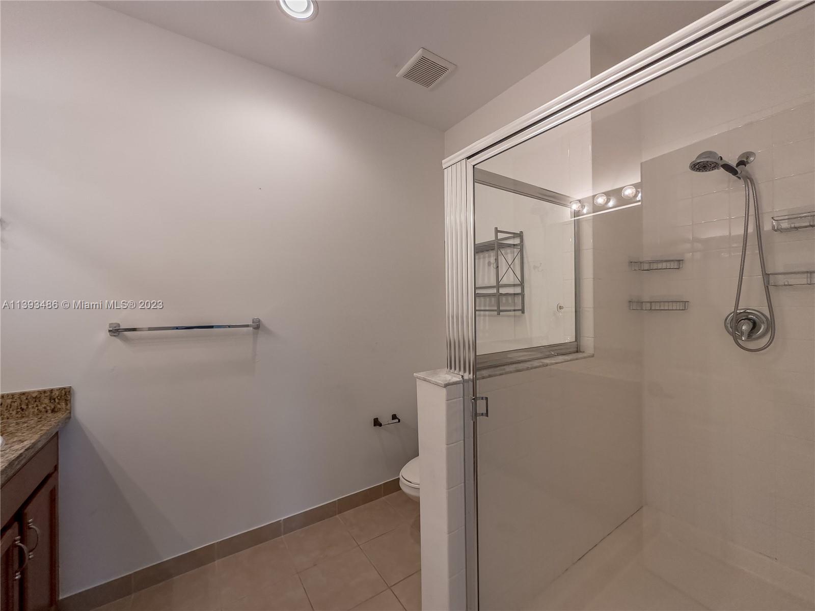 865 Southwest 147th Avenue, Unit 1908 Pembroke Pines, FL 33027 - Photo 20 of 30 a bathroom with a shower