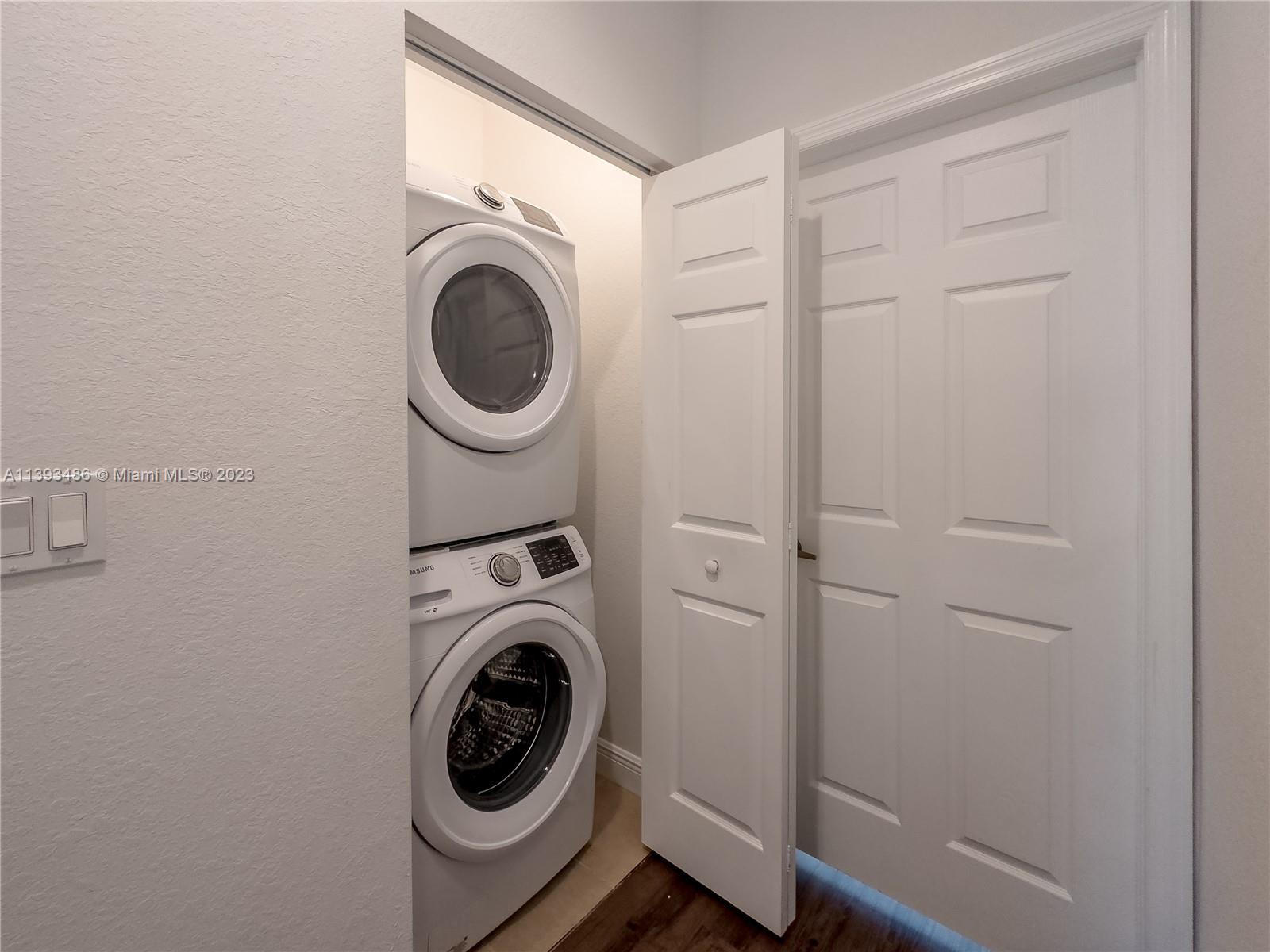 865 Southwest 147th Avenue, Unit 1908 Pembroke Pines, FL 33027 - Photo 28 of 30 a utility room with dryer and washer