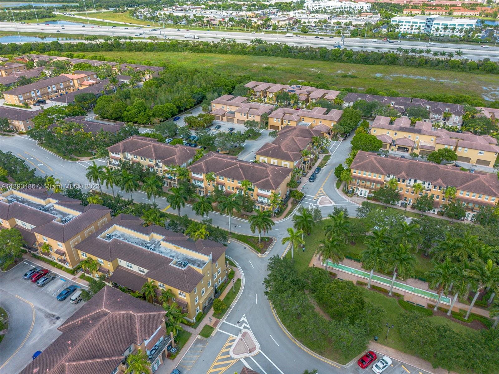 865 Southwest 147th Avenue, Unit 1908 Pembroke Pines, FL 33027 - Photo 3 of 30 an aerial view of tennis court