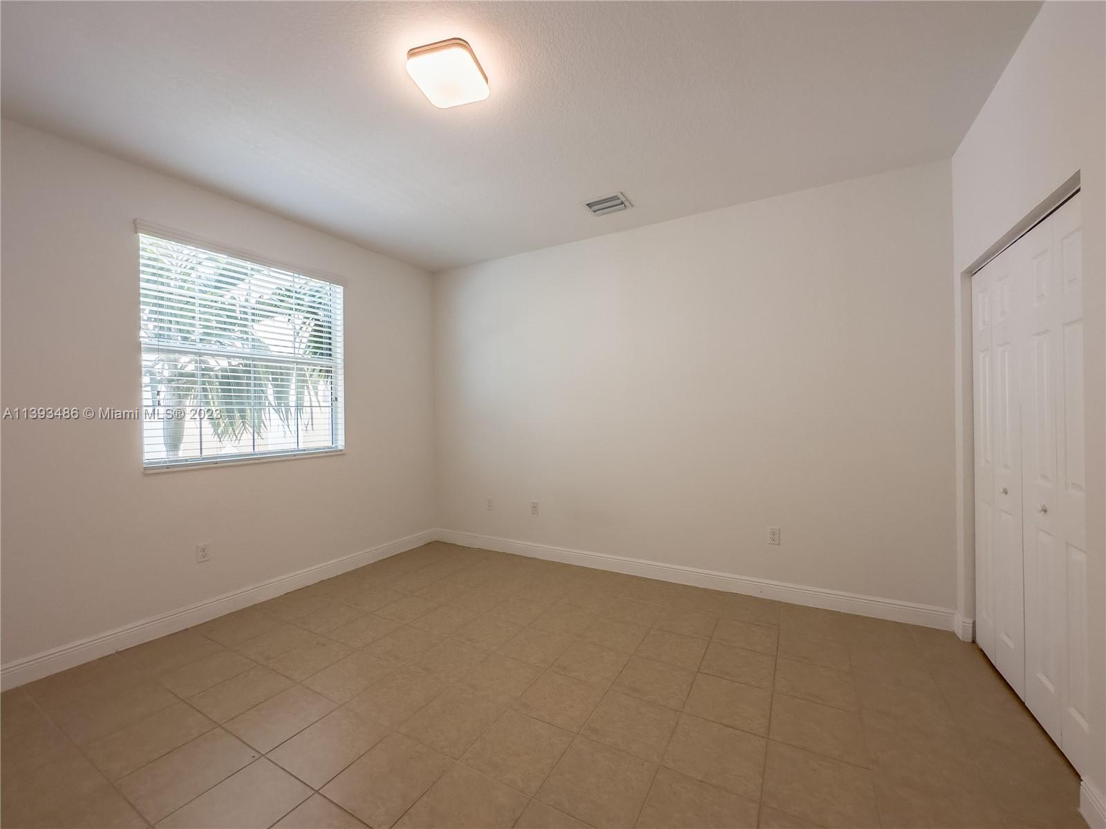 865 Southwest 147th Avenue, Unit 1908 Pembroke Pines, FL 33027 - Photo 9 of 30 an empty room with windows