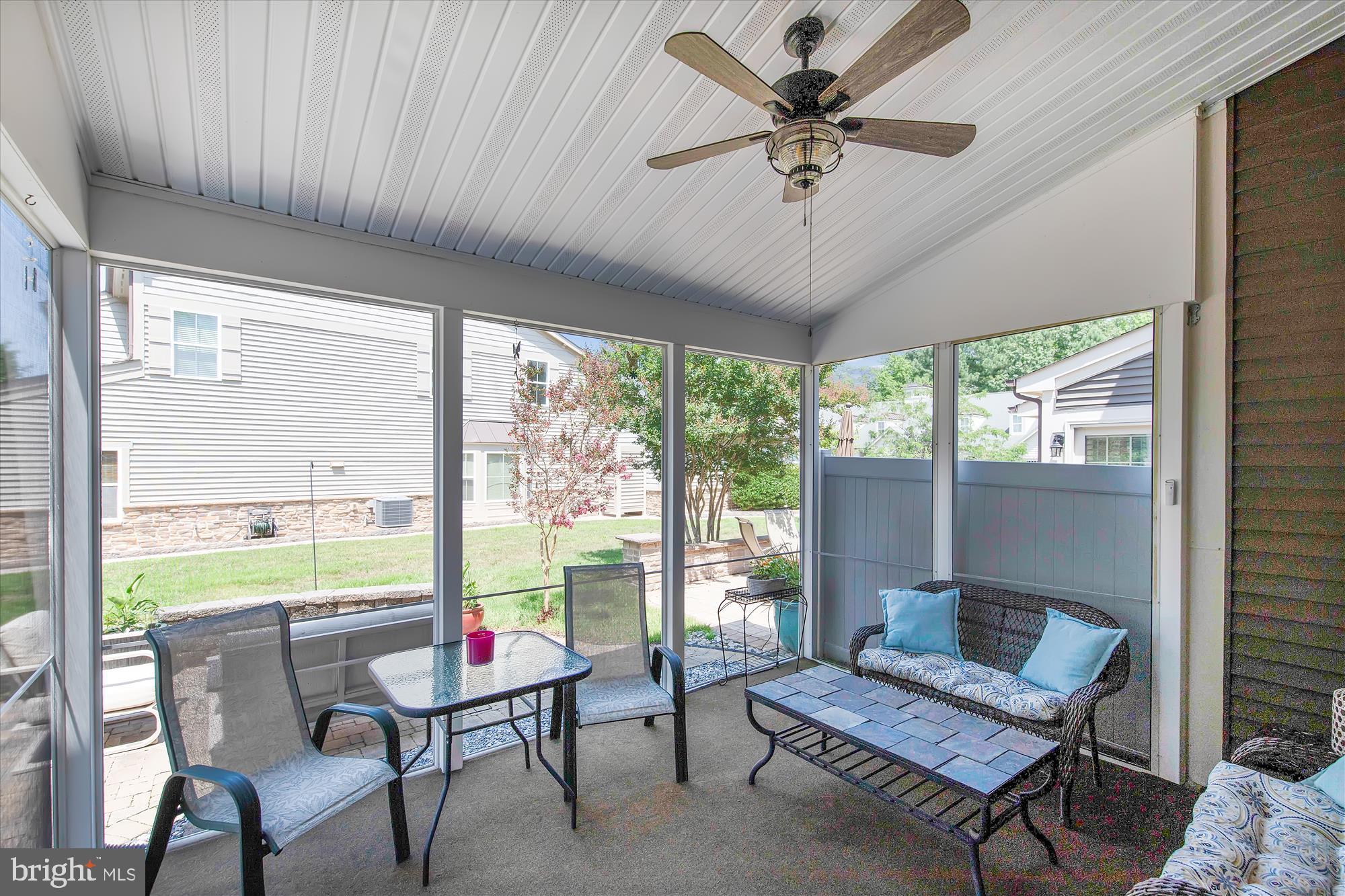 36403 Junco Road, Unit 211B Ocean View, DE 19970 - Photo 21 of 78 Screened Porch overlooks paver patio